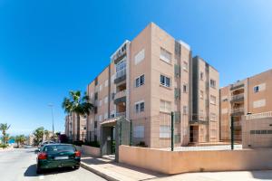 a car parked in front of a building at San Sebastián 22 in Torrevieja