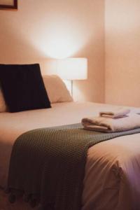 a hotel room with a bed with a lamp on it at Seaview Retreat in Adventure Bay