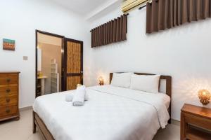 Кровать или кровати в номере GLOBALSTAY. 2 Bedroom Villa Casa Yenny with Private Pool Near Seminyak Beach