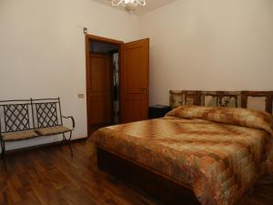 a bedroom with a bed and a chair in it at Princess House Palermo - Intero Appartamento - Mondello in Mondello
