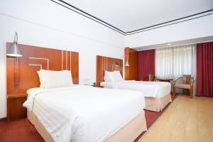 Postel nebo postele na pokoji v ubytování Hotel Savoy Homann