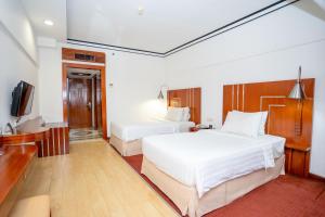 Postel nebo postele na pokoji v ubytování Hotel Savoy Homann