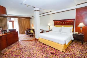 Postel nebo postele na pokoji v ubytování Hotel Savoy Homann