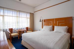 Postel nebo postele na pokoji v ubytování Hotel Savoy Homann