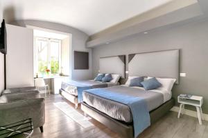 A bed or beds in a room at Scipioni Best Rooms