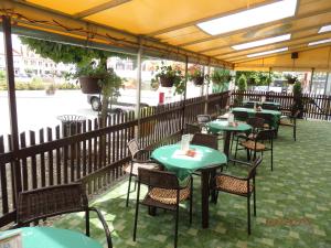 a row of tables and chairs on a patio at Hotel Morava Jevíčko in Jevíčko +15 photos