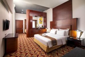 Postel nebo postele na pokoji v ubytování Hotel Savoy Homann