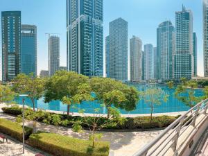 a view of a city skyline with tall buildings at Cosmos Living Luxurious Studio Near Metro in Dubai