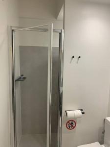 a glass shower in a bathroom with a toilet at E2G URBAN STAY with Balcony in Thessaloniki