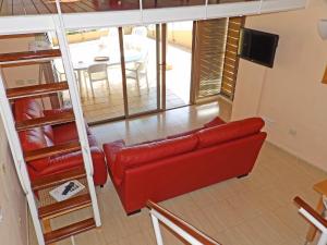 A television and/or entertainment centre at Apartamentos Medano - Duplex Playa