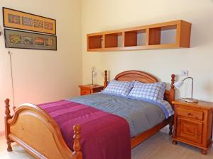 A bed or beds in a room at Apartamentos Medano - Duplex Playa