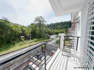 a balcony with a view of a road at ZEN RESIDENCE 135 LANGKAWI- 4BR3B-Max 14pax in Kuah