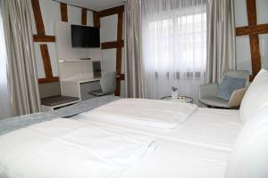 Postel nebo postele na pokoji v ubytování Hotel Hoeri am Bodensee