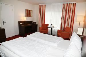 Postel nebo postele na pokoji v ubytování Hotel Hoeri am Bodensee