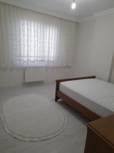 Una cama o camas en una habitación de شقة مفروشة للايجار اليومي - كاشيستو -يومرا
