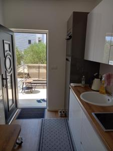 Kuchyň nebo kuchyňský kout v ubytování Apartments Jozef