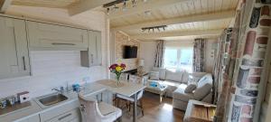 a kitchen and living room in a tiny house at The Ocean Lodge in Bunbeg