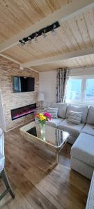 a living room with a couch and a table at The Ocean Lodge in Bunbeg