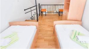 Ένα ή περισσότερα κρεβάτια σε δωμάτιο στο Majka Apartments