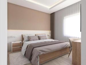 ein Schlafzimmer mit einem großen Bett und einem Fenster in der Unterkunft Apartments Villa Subic in Rab
