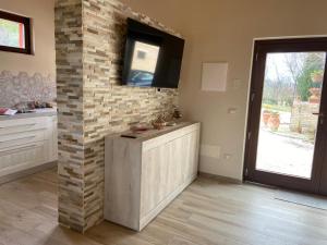 A television and/or entertainment centre at Villa Giulia - Homelike Villas