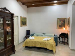 Ένα ή περισσότερα κρεβάτια σε δωμάτιο στο Sasha House Casa Vacanze +11 φωτογραφίες