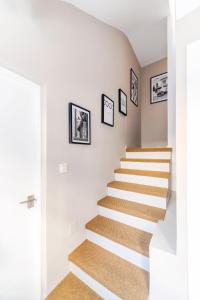 a staircase in a home with white walls and stair carpet at Bella Marbella in Marbella