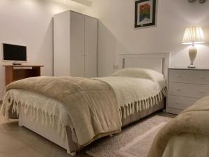 Tencarola B & B tesisinde bir odada yatak veya yataklar