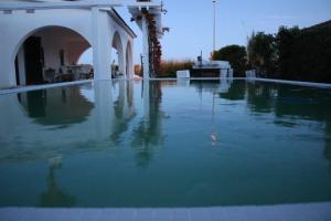 a pool of water in the middle of a house at Casa Eucaliptus in L'Eucaliptus