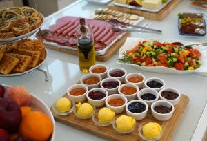 a buffet with different types of food on a table at The Maltese Sun in Sliema