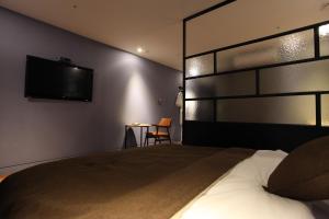 En eller flere senger på et rom på Hotel Banwol
