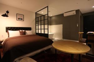 Cama ou camas em um quarto em Hotel Banwol