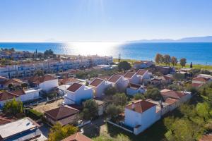 an aerial view of a town next to the ocean at SLV Dionysos Apartment in Ofrínion