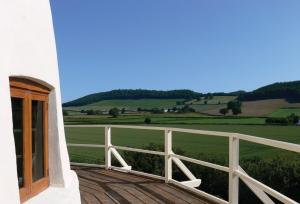 a balcony with a view of a green field at Llancayo Windmill in Monkswood