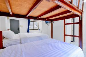 Postel nebo postele na pokoji v ubytování GP House Krabi Aonang Beach