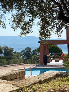 a swimming pool in front of a house at Lepeda's Pearl in Lixouri