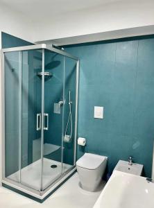 a bathroom with a glass shower and a toilet at Casaincentro civitanova in Civitanova Marche