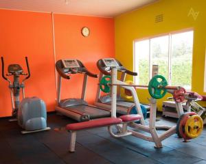 a gym with several exercise bikes in a room at Cozy Nest Wi-Fi, Netflix call:0707070617 in Eldoret