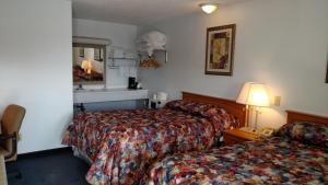 Postel nebo postele na pokoji v ubytování A Wyoming Inn