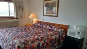 Postel nebo postele na pokoji v ubytování A Wyoming Inn