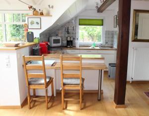Kuchyň nebo kuchyňský kout v ubytování Ferienhaus "Am Deich 30"