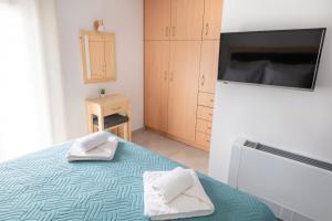 Letto o letti in una camera di Serenity apartment Mochlos