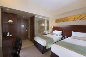 Llit o llits en una habitació de Brighton Hotel Hong Kong