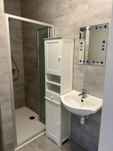 a bathroom with a sink and a shower at Happy Home Eeklo in Centre in Eeklo +30 photos