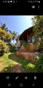 a picture of a house with a fence around it at Mount Haven in Kandy