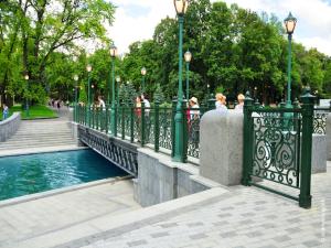 a bridge over a river in a park at Central Park Apartment on Sumskaya in Kharkiv