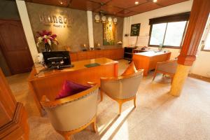 a salon with chairs and a reception desk and a waiting room at Pinnacle Samui Resort in Mae Nam