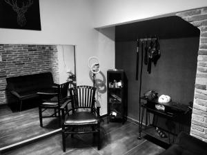 a black and white photo of a living room at Fifty Shapes in Nesher