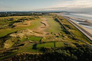 an aerial view of a golf course next to the ocean at Redstone Rise Luxury house sleeps 7 in Birkenhead