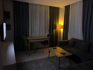 a living room with a couch and a table at Lux apartment in Cafeler caddesi in Antalya